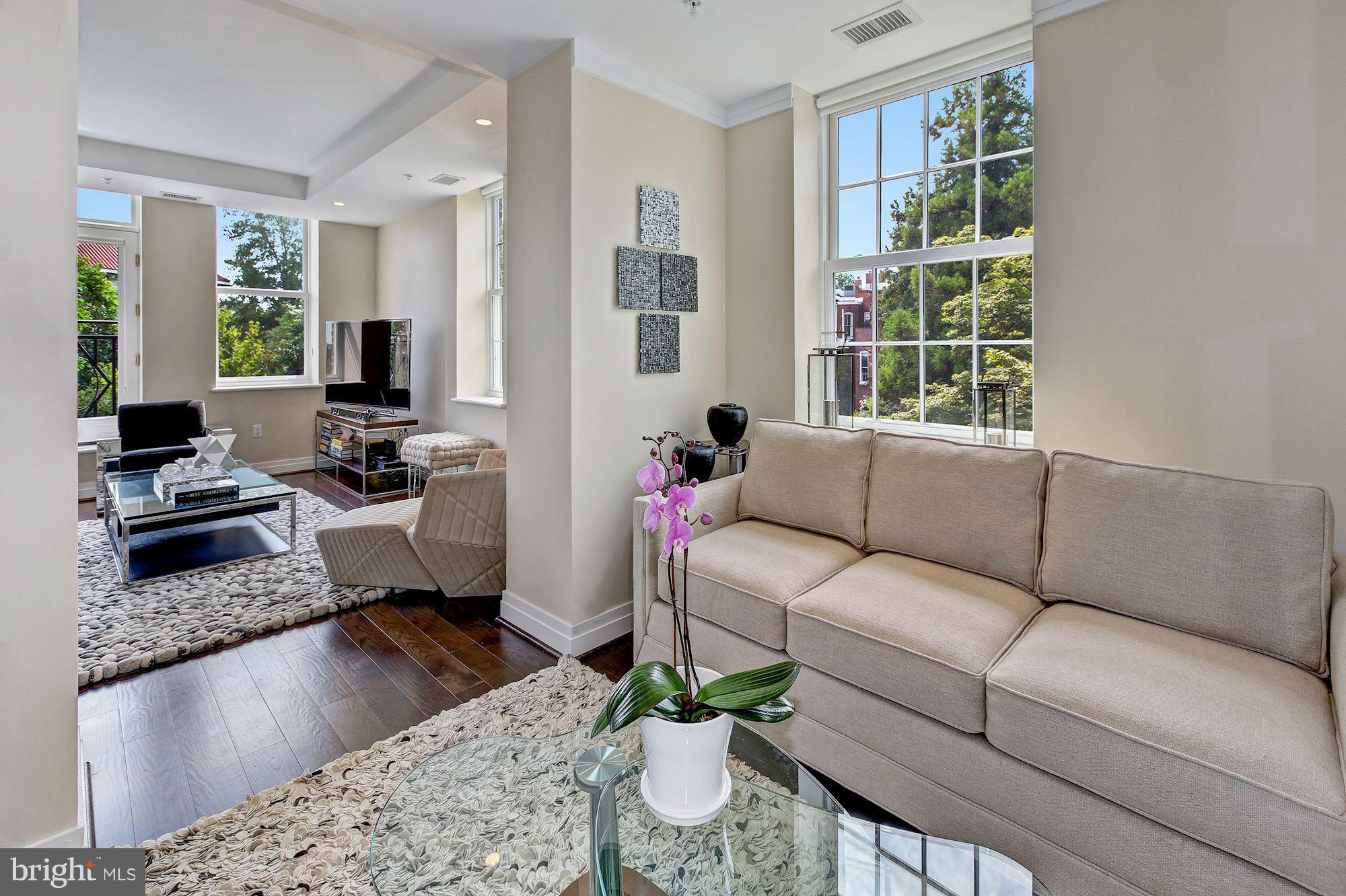 3052 R Street Northwest, Unit 301 Washington, DC 20007 - Photo 13 of 30 a living room with furniture and a large window