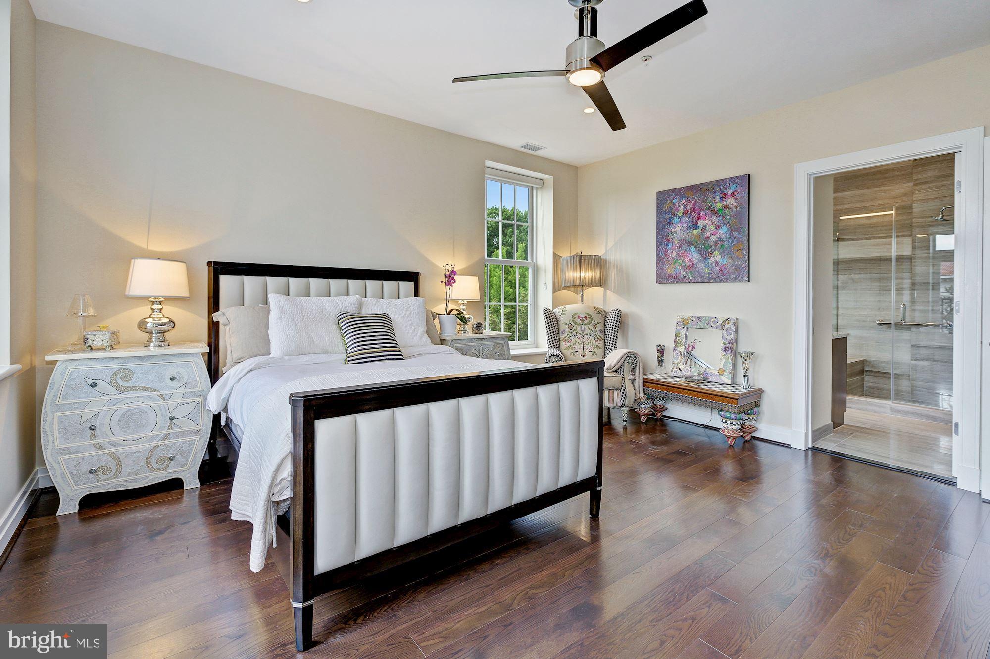 3052 R Street Northwest, Unit 301 Washington, DC 20007 - Photo 17 of 30 a bedroom with furniture and wooden floor
