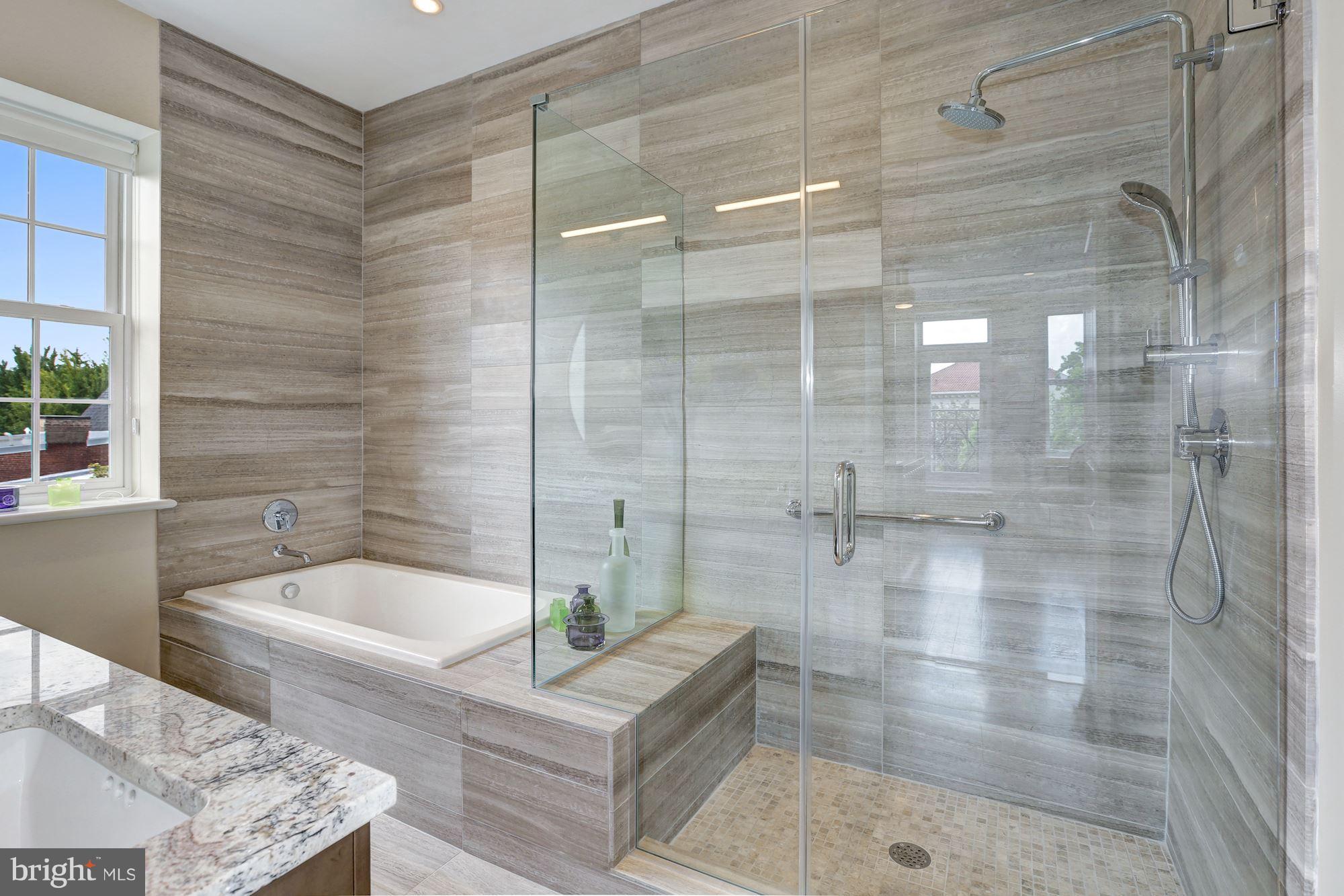 3052 R Street Northwest, Unit 301 Washington, DC 20007 - Photo 20 of 30 a bathroom with a bathtub and shower
