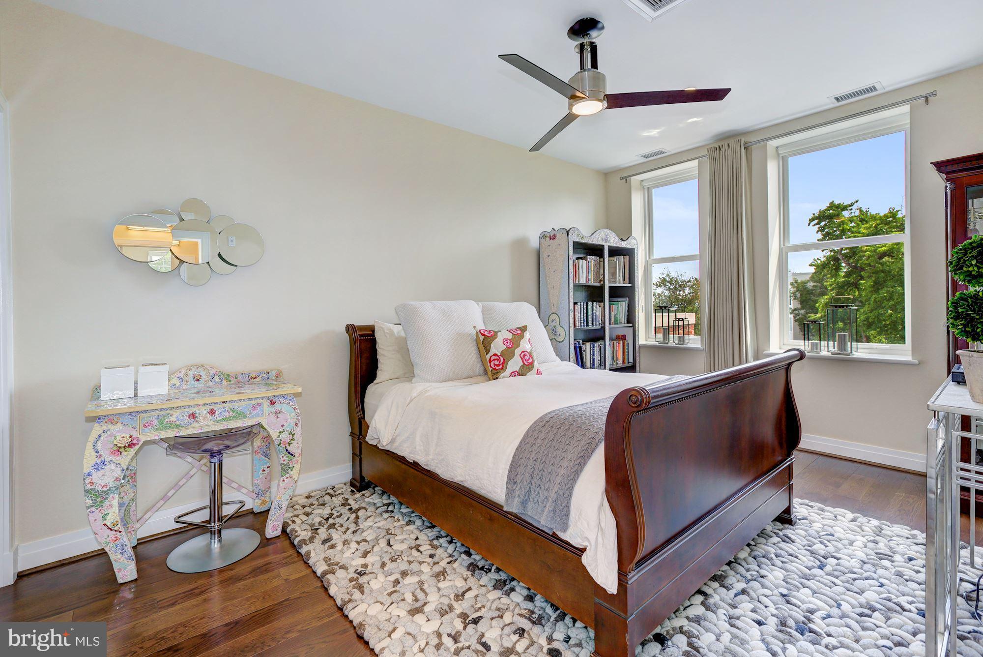 3052 R Street Northwest, Unit 301 Washington, DC 20007 - Photo 23 of 30 a bed room with a bed and a chair
