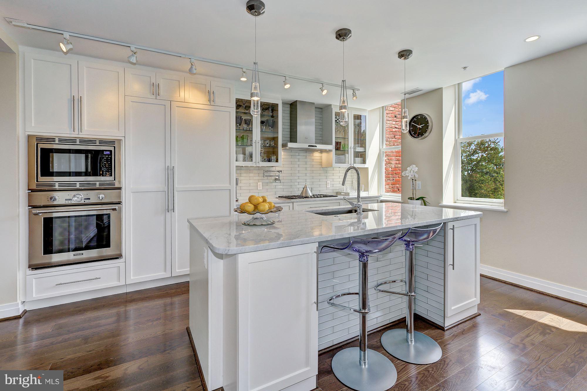 3052 R Street Northwest, Unit 301 Washington, DC 20007 - Photo 5 of 30 a kitchen with a sink cabinets and appliances