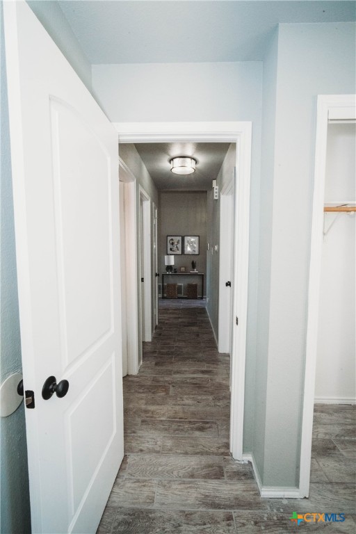 2607 Rampart Loop Killeen, TX 76542 - Photo 14 of 34 a view of a hallway with wooden floor and staircase