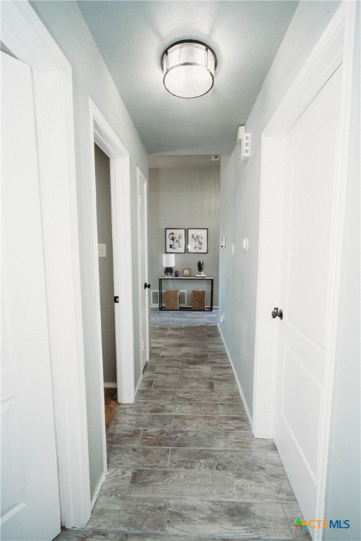 2607 Rampart Loop Killeen, TX 76542 - Photo 15 of 34 a view of a hallway with wooden floor
