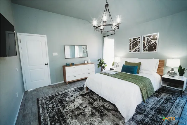 a bedroom with bed and window