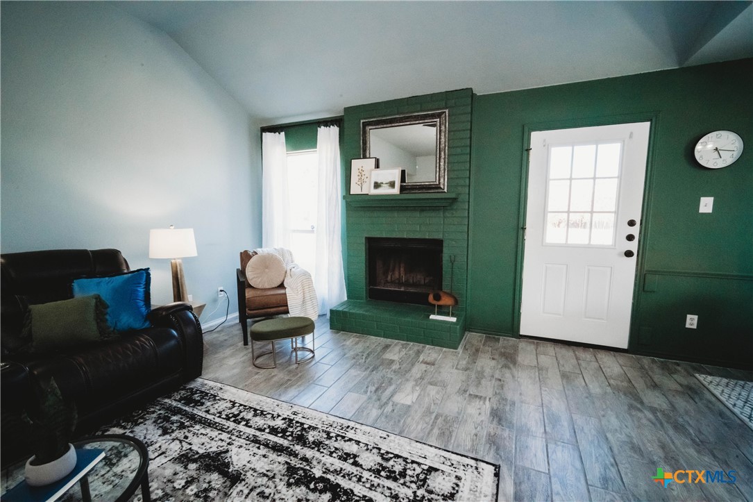 2607 Rampart Loop Killeen, TX 76542 - Photo 3 of 34 a living room with furniture and a fireplace