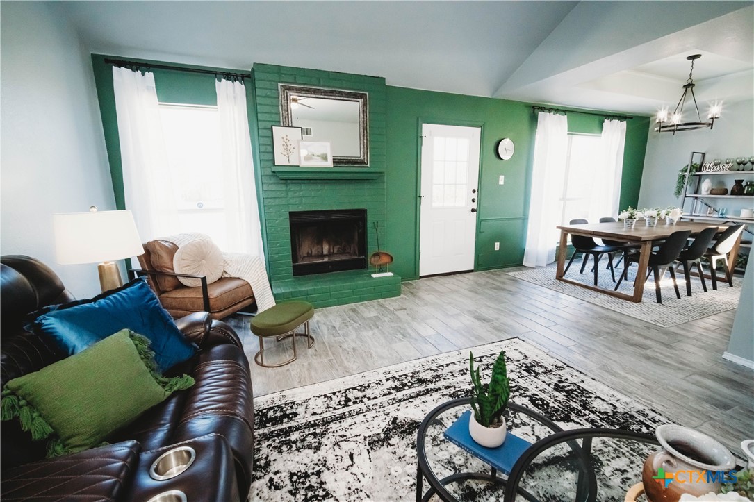 2607 Rampart Loop Killeen, TX 76542 - Photo 4 of 34 a living room with furniture and a fireplace