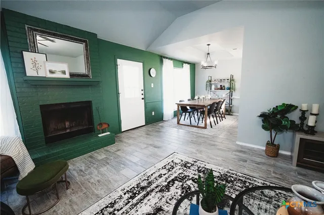 a living room with furniture and a fireplace
