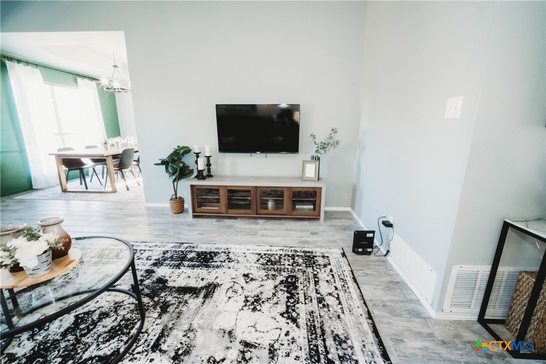 2607 Rampart Loop Killeen, TX 76542 - Photo 7 of 34 a living room with furniture and a flat screen tv
