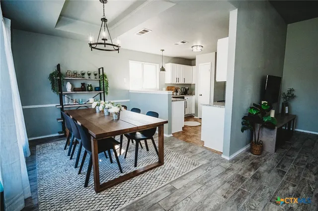 a view of a dining room with furniture
