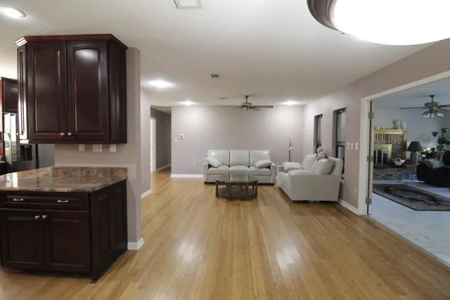 a backyard of a house with lots of green space and garden