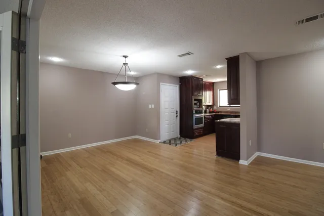 a view of a porch with chairs and backyard