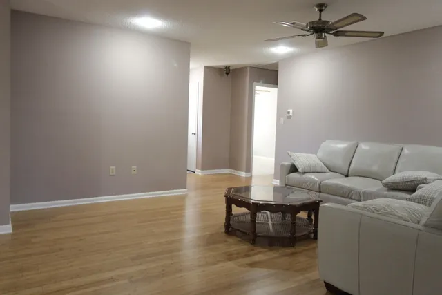 a view of a chair and table in the garden
