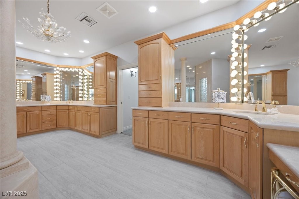 640 Quail Covey Road Henderson, NV 89002 - Photo 18 of 75 Primary Bathroom featuring vanity, a chandelier, recessed lighting, and decorative columns