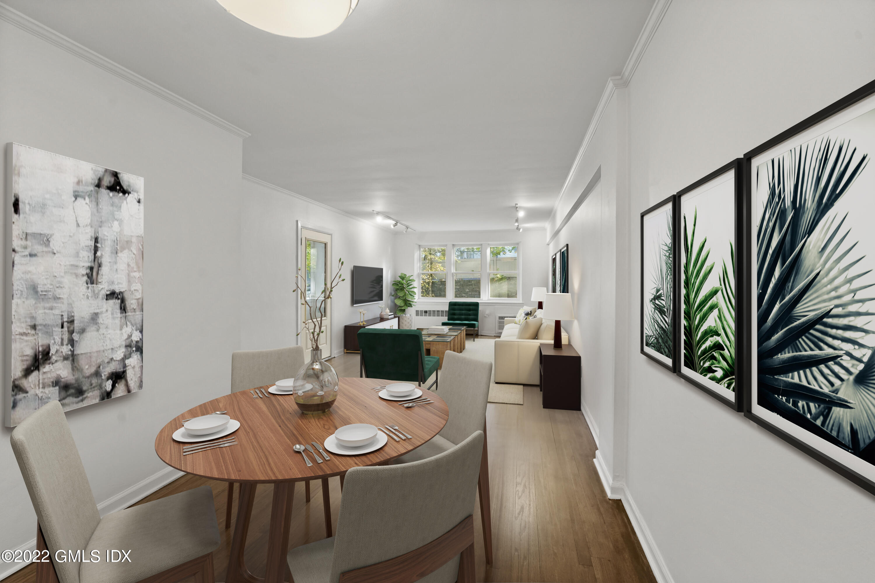 52 Lafayette Place, Unit 2H Greenwich, CT 06830 - Photo 1 of 11 a view of a dining room with furniture and wooden floor