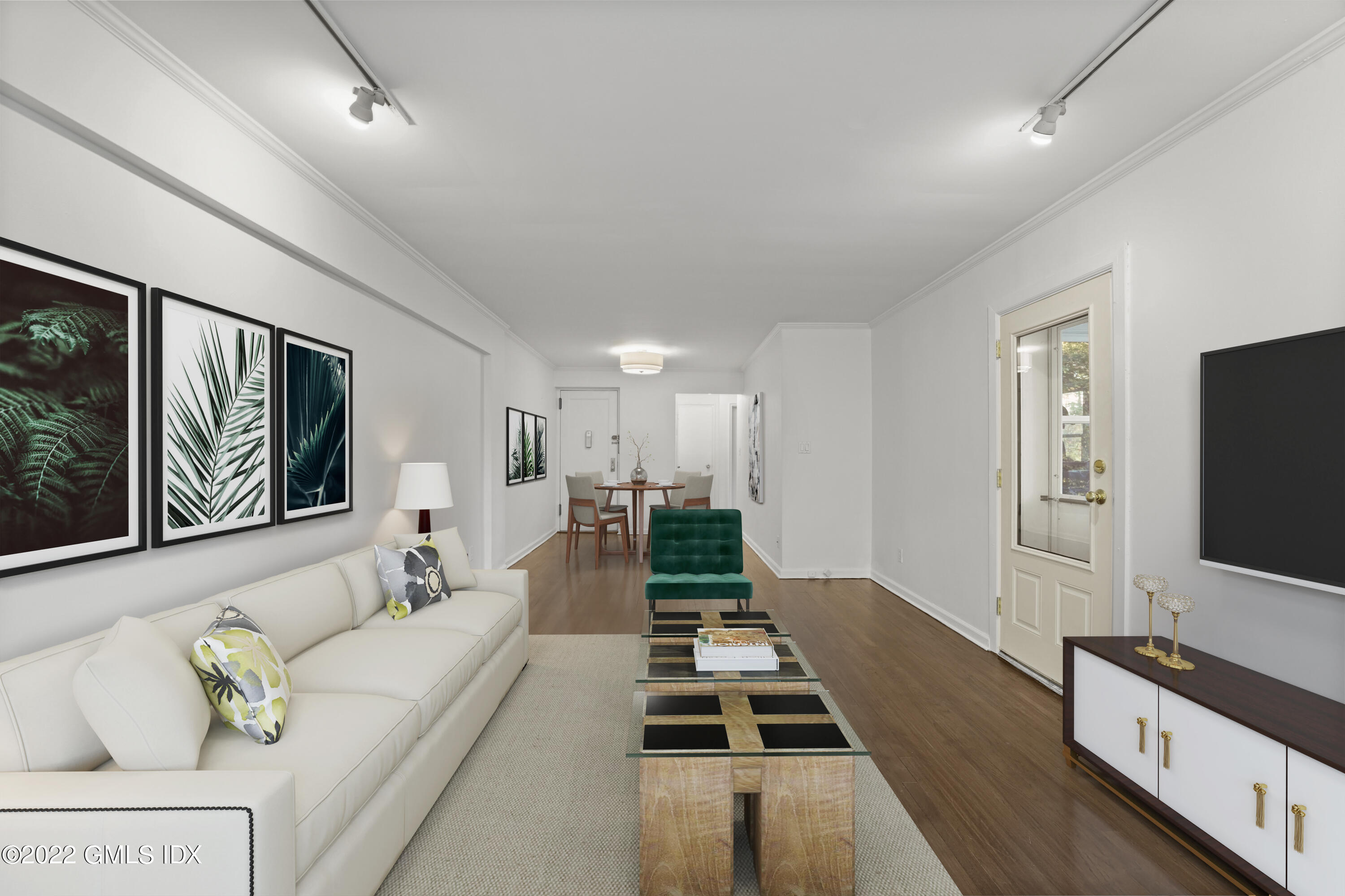 52 Lafayette Place, Unit 2H Greenwich, CT 06830 - Photo 3 of 11 a living room with furniture and a flat screen tv