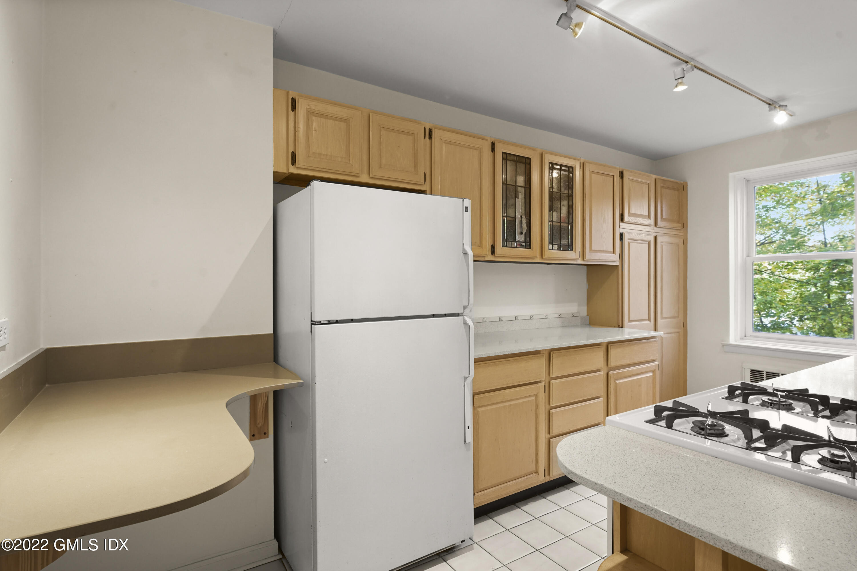 52 Lafayette Place, Unit 2H Greenwich, CT 06830 - Photo 4 of 11 a kitchen with a refrigerator and a stove