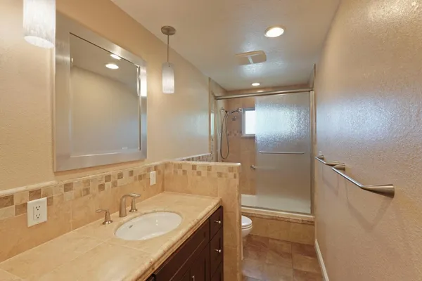 a bathroom with a sink double vanity and a mirror