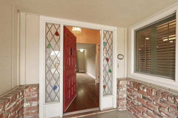 a view of front door with a door and couch