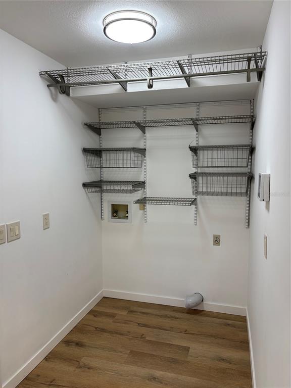 9801 Southeast Sunset Harbor Road Summerfield, FL 34491 - Photo 22 of 37 a view of a room with racks on the wall