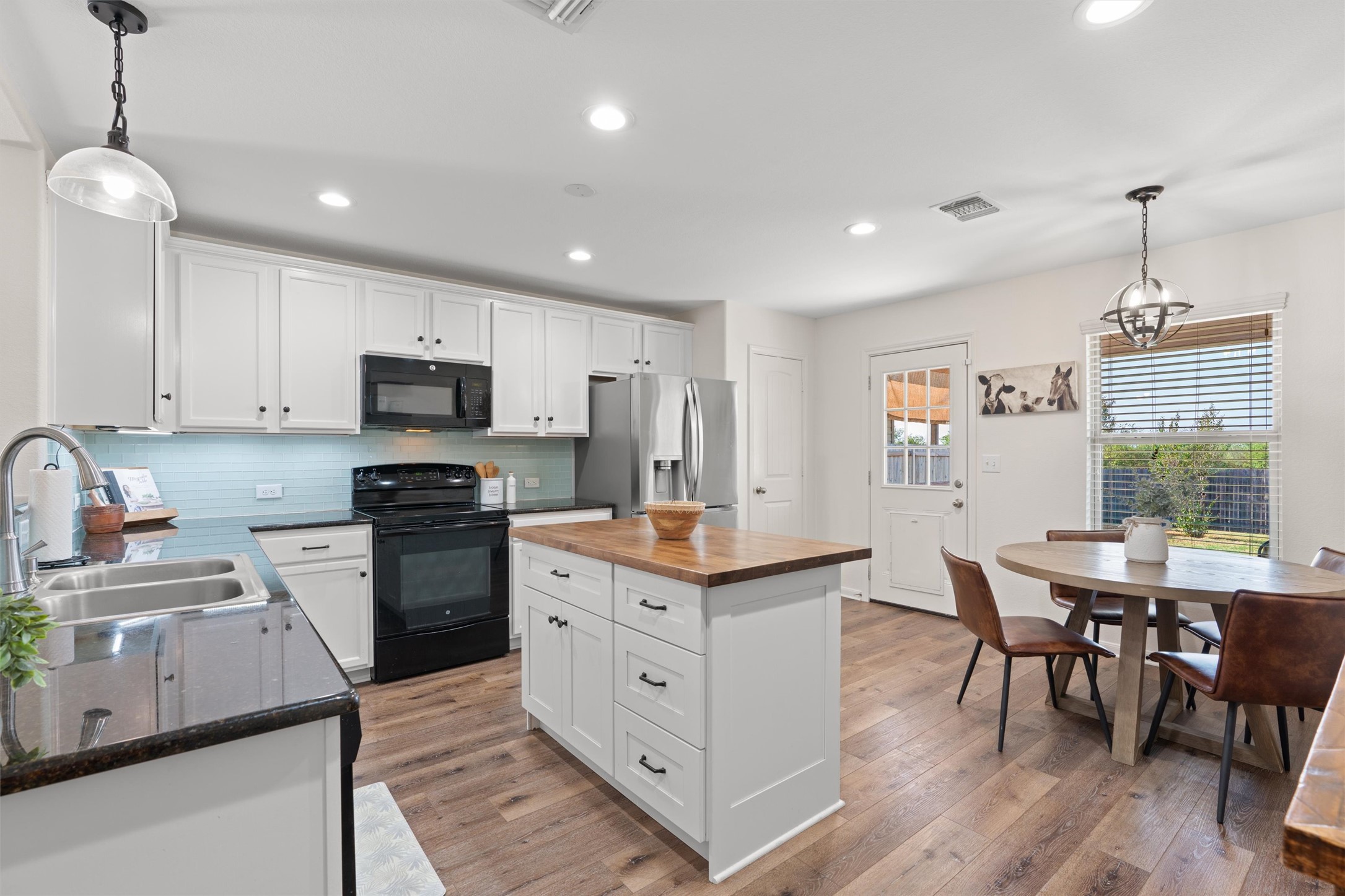 505 Granger Road Georgetown, TX 78626 - Photo 1 of 34 Enjoy the extra storage with the built-in island. Beautiful backsplash with granite counter.s