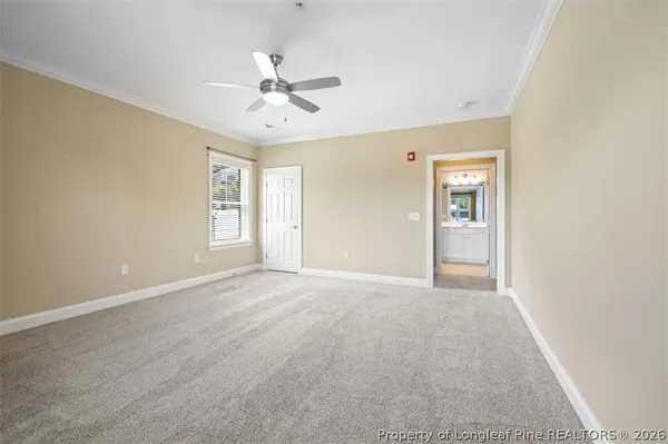 a kitchen with stainless steel appliances a refrigerator a sink and wooden floor