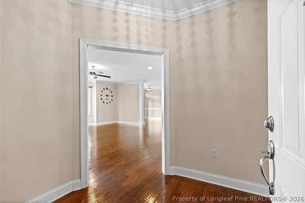 a view of a kitchen with wooden floor