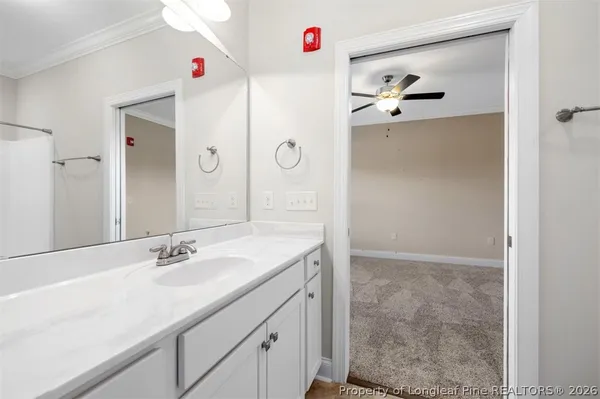 an aerial view of a house with swimming pool and outdoor seating