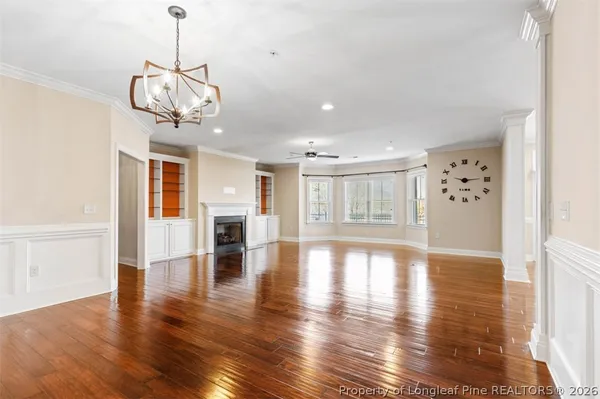 a view of hallway with wooden floor
