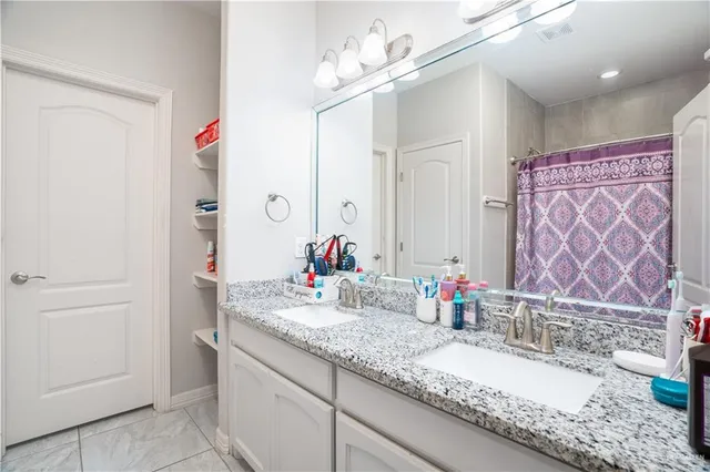 a bedroom with a large bed and a dresser