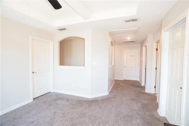 a bedroom with a bed and a table in it