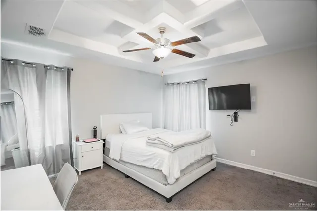 a bedroom with a bed window and a flat screen tv