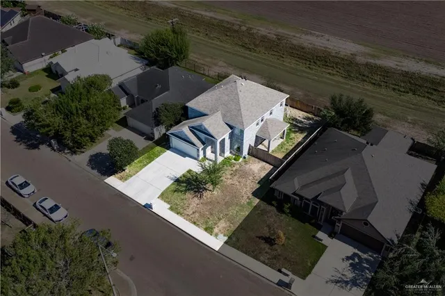 an aerial view of house with yard