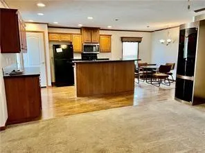 a view of kitchen with refrigerator cabinets and outdoor counter
