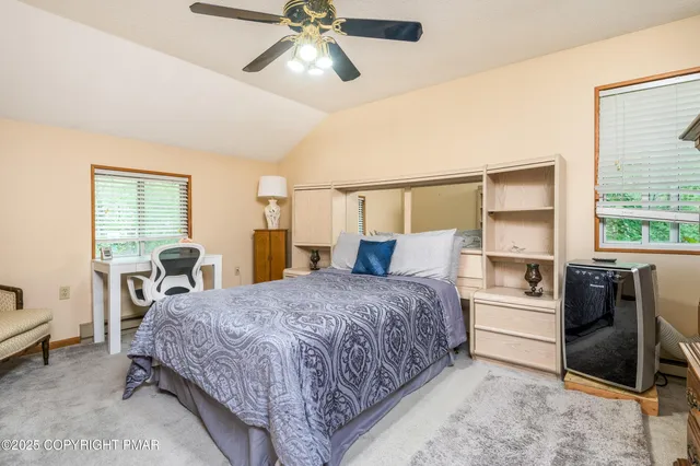 a kitchen with a table chairs refrigerator and microwave