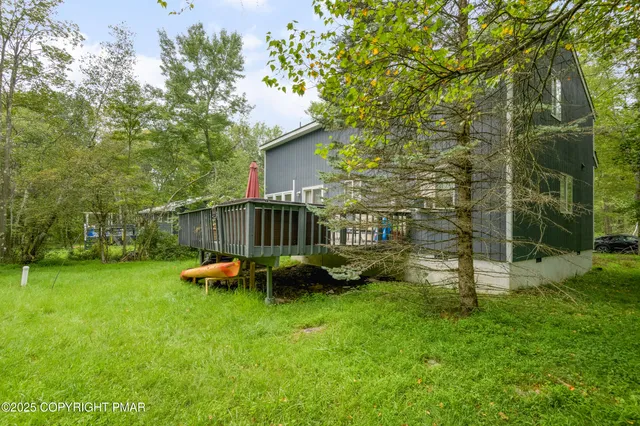 a view of backyard with a garden and entertaining space