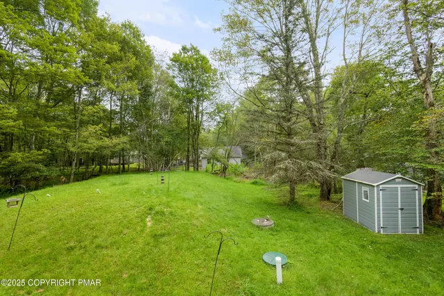a dining room with furniture and a window