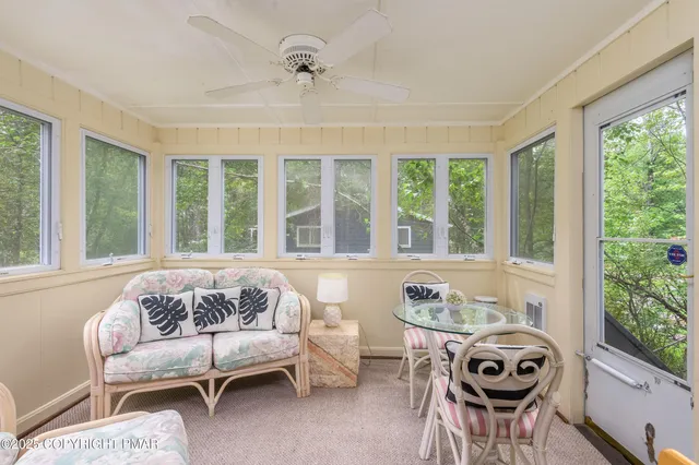 a living room with furniture and windows