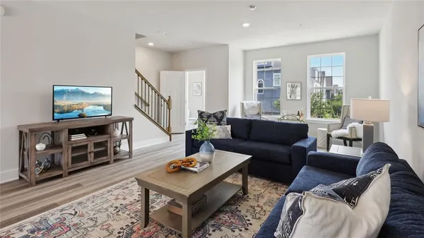 a living room with furniture and a flat screen tv