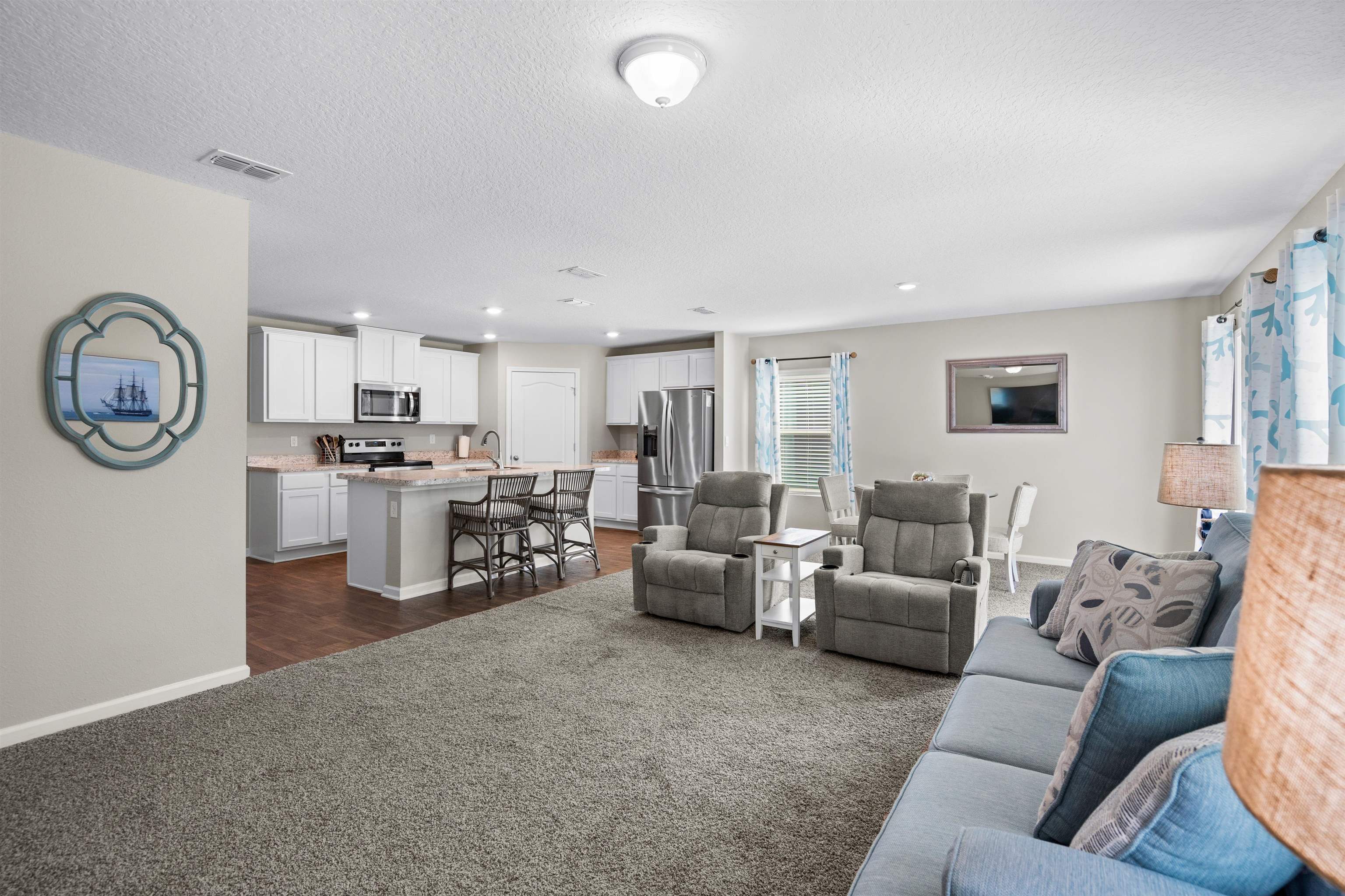 408 Falcon Ridge Road St. Augustine, FL 32084 - Photo 14 of 26 a living room with furniture and a clock