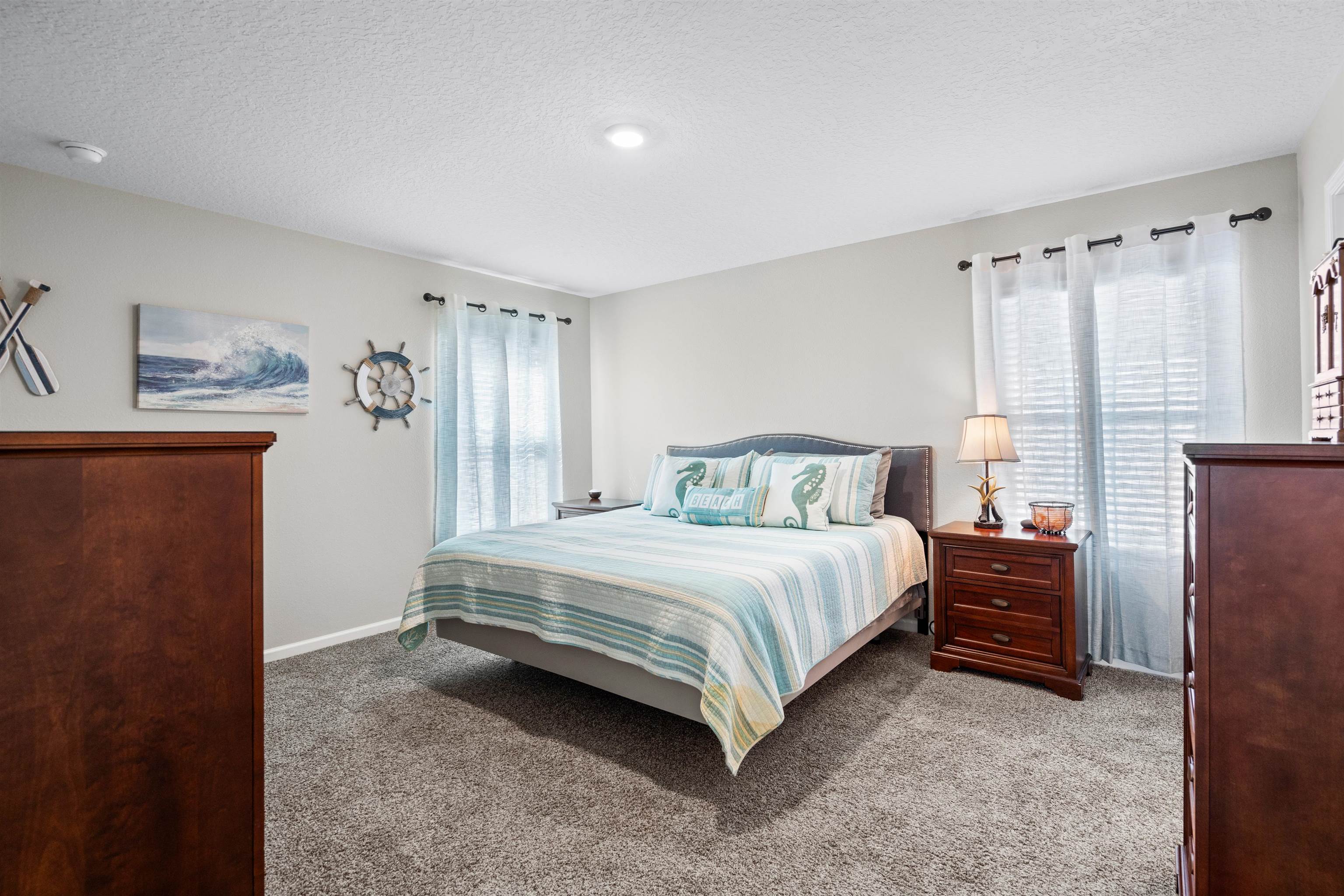 408 Falcon Ridge Road St. Augustine, FL 32084 - Photo 15 of 26 a bedroom with a bed and a window