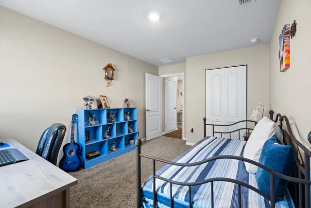 a view of a livingroom with furniture and lounge chair