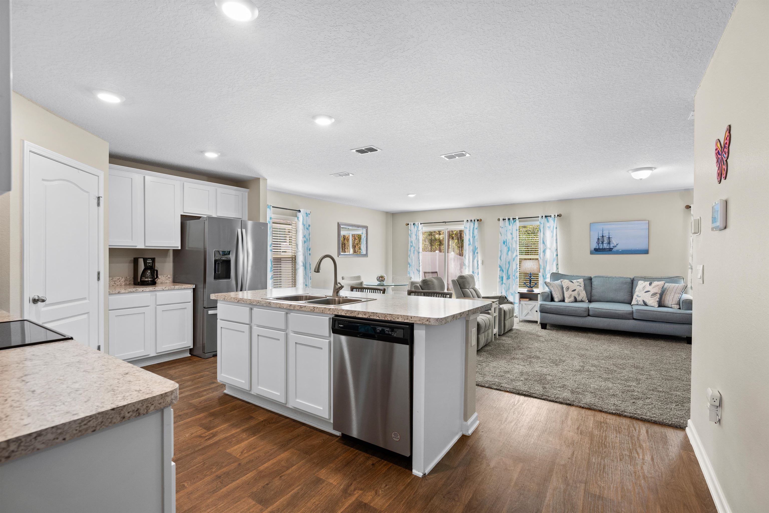 408 Falcon Ridge Road St. Augustine, FL 32084 - Photo 9 of 26 a kitchen with stainless steel appliances kitchen island granite countertop a stove and a sink