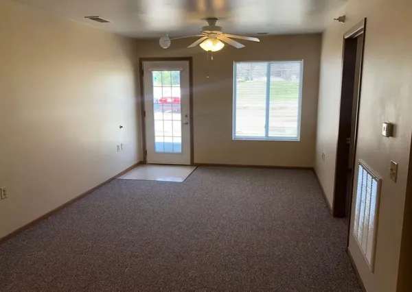 a view of an empty room with a window