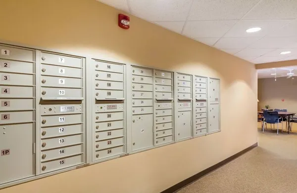 a view of walk in closet with clothes