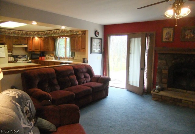 7405 State Road Wadsworth, OH 44281 - Photo 9 of 25 Family room, and looking into the kitchen. the doors are leading out onto the deck and looking out onto thee backyard.