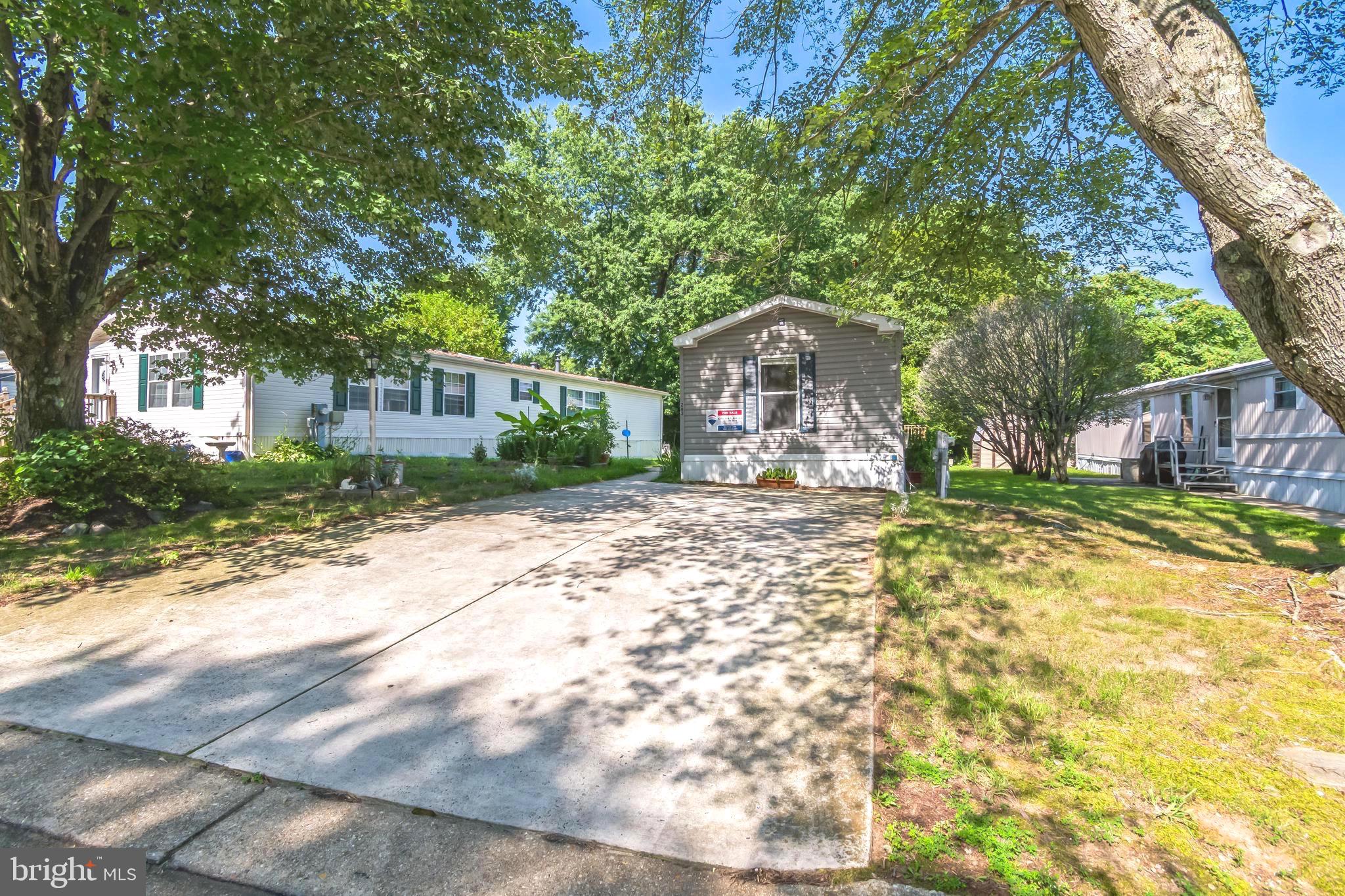 263 Konrad Morgan Way Lothian, MD 20711 - Photo 1 of 18 a front view of a house with a yard