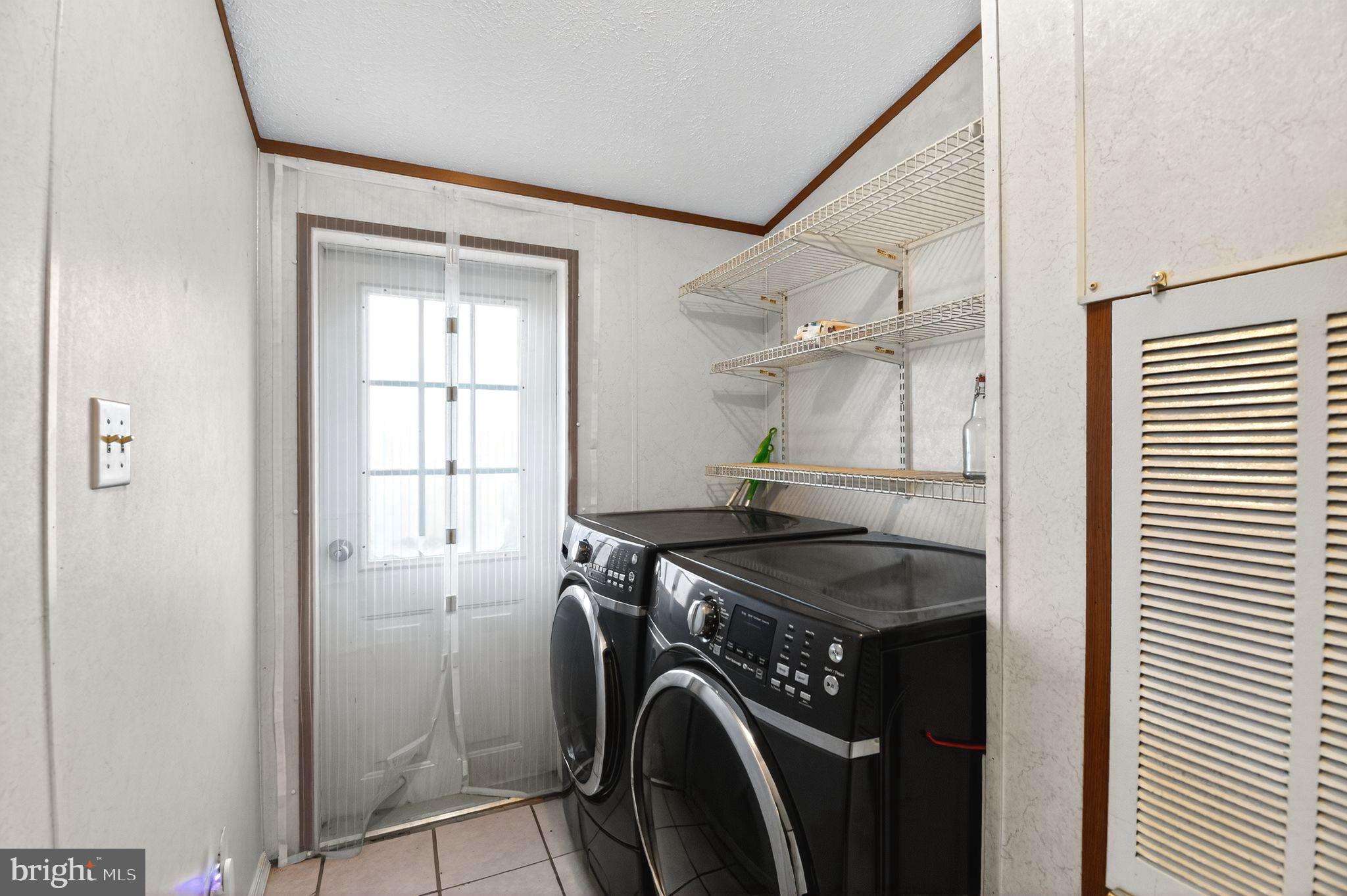 263 Konrad Morgan Way Lothian, MD 20711 - Photo 10 of 18 a utility room with closet dryer and washer