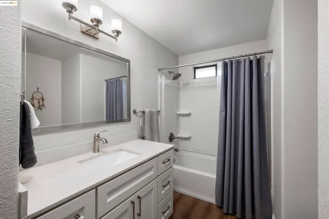 a bathroom with a sink double vanity and a mirror