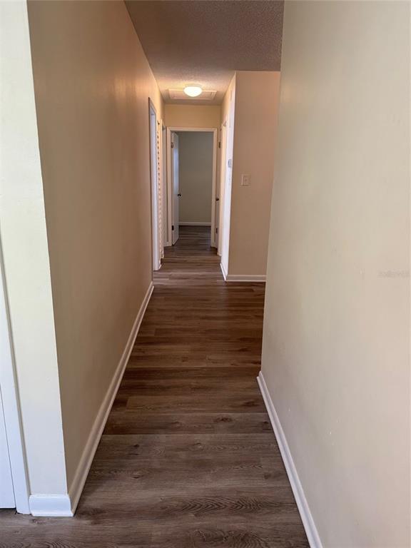 1740 West Walnut Street Tampa, FL 33607 - Photo 10 of 21 a view of a hallway with wooden floor and staircase