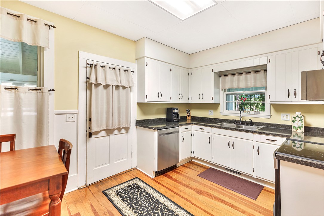 205 West Mauldin Street Walhalla, SC 29691 - Photo 11 of 43 A well-equipped kitchen features ample cabinetry, gleaming countertops, durable hardwood flooring, and a walk in pantry.